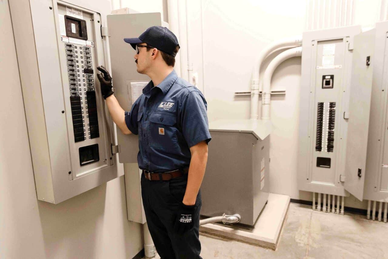 A Lee Company technician serving electrical issues in commercial buildings