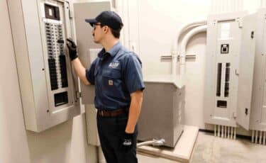 A Lee Company technician serving electrical issues in commercial buildings