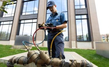 Backflow prevention in commercial buildings being performed by a Lee Company technician